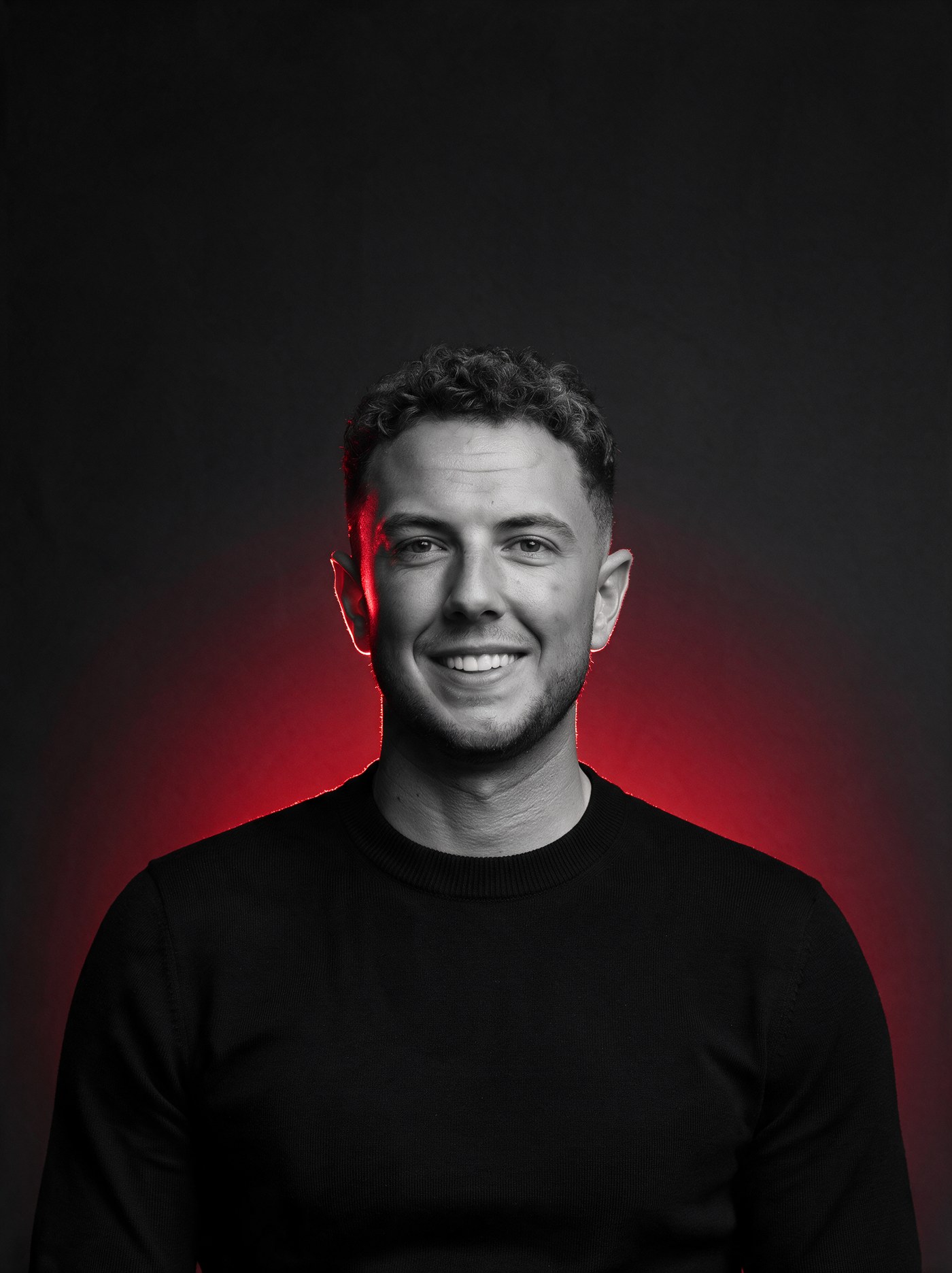Tommy, founder of Ninja Leads, portrait with red glow